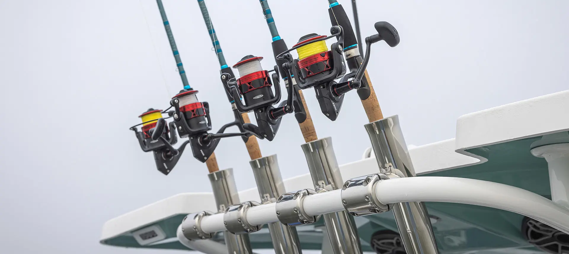 4 fishing poles on a Hurricane Center Console fishing deck boat.