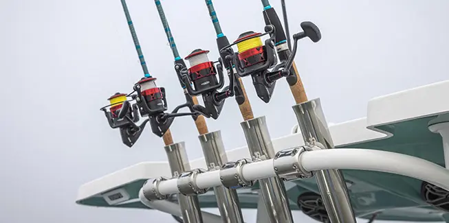 4 fishing poles on a Hurricane Center Console fishing deck boat.