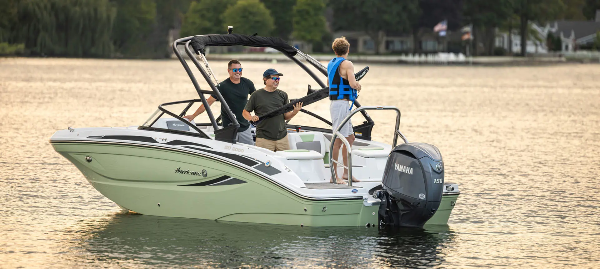 Rear-view of a parked Hurricane Sundeck 2050 OB on the water.