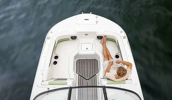 Overhead view of a passenger relaxing on front seating on a Hurricane 2050 OB.
