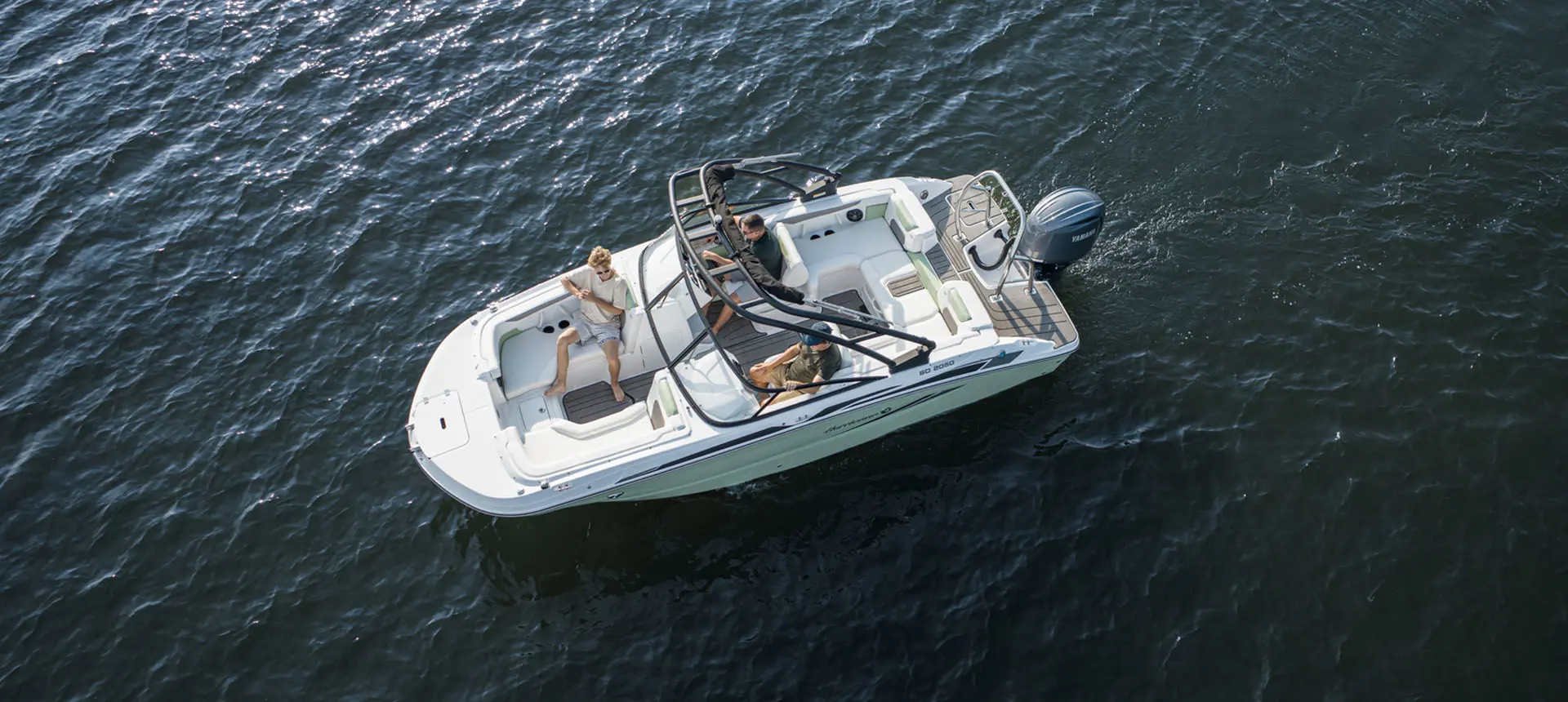 Overhead view of a family cruising lake on a Hurricane Sundeck 2050 OB.
