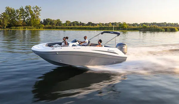 Front view of family cruising in a Hurricane Sundeck Sport 192 RL OB on lake.