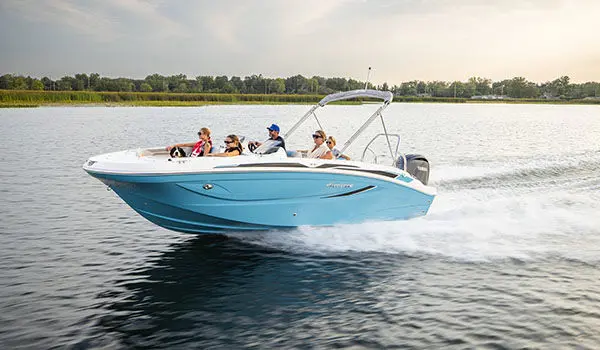 Family speeds across lake on a Hurricane Sundeck Sport 2050 OB.