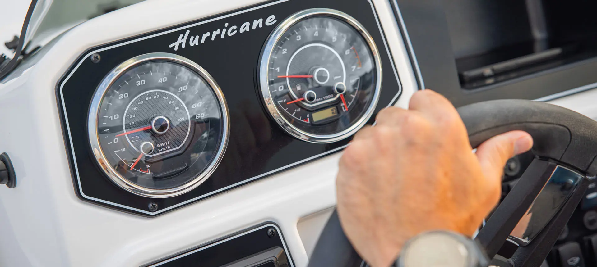 Dashboard gauge detail on a Hurricane Sundeck Sport 2050 OB.
