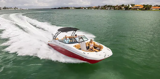 3 people enjoying the ocean on a Hurricane yacht certified deck boat.