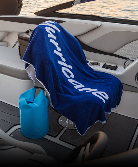 Hurricane branded towel draped over a deck boat seat. 