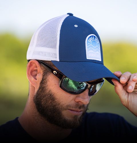 Man wearing Hurricane Boats hat. 