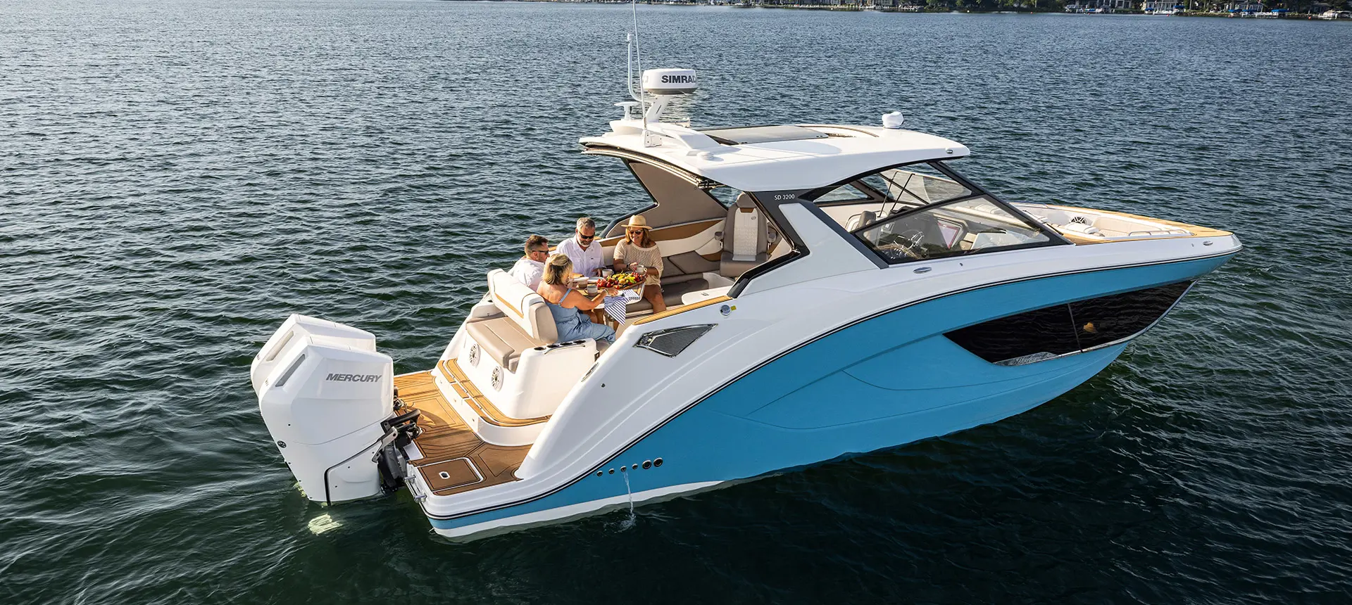Side profile of a Hurricane SunDeck 3200 OB entertainment deck boat.