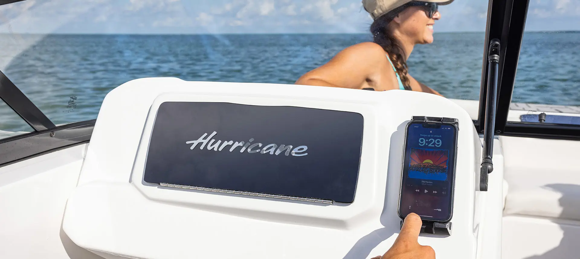 Phone holder and glovebox on a Hurricane Entertainment deck boat.