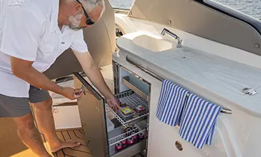 Pull-out fridge on a Hurricane Entertainment deck boat.