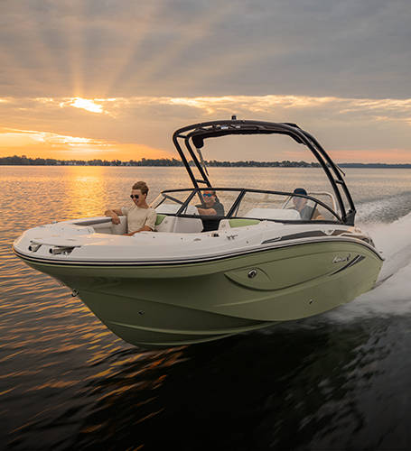 Family speeds across lake on a Hurricane Deck Boat. 