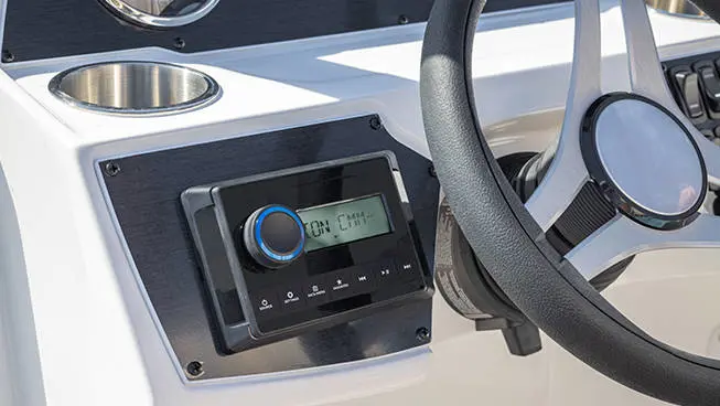 Audio console on the helm of a Hurricane SunDeck OB deck boat.