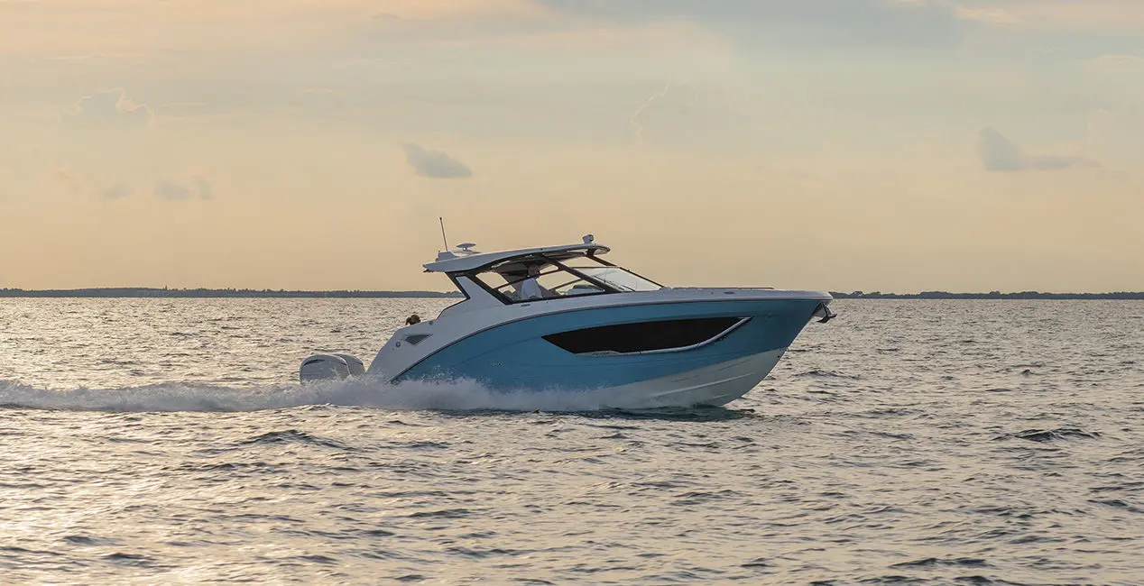 Side profile of a Hurricane Yacht Certified boat cruising across the ocean.
