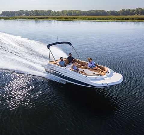 Hurricane sterndrive io boat showcasing performance as it speeds across the lake.