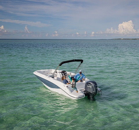 Rear view of a parked Hurricane sterndrive io boat.