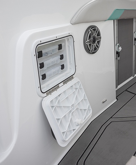 Tackle box storage on a Hurricane Center Console boat.