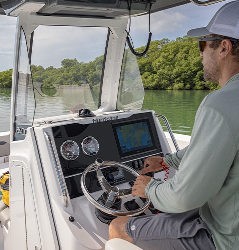 Captain operating functional help on a Hurricane Center Console boat.