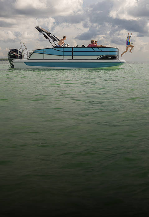 Girl jumping off the front of a parked Hurricane FunDeck boat.