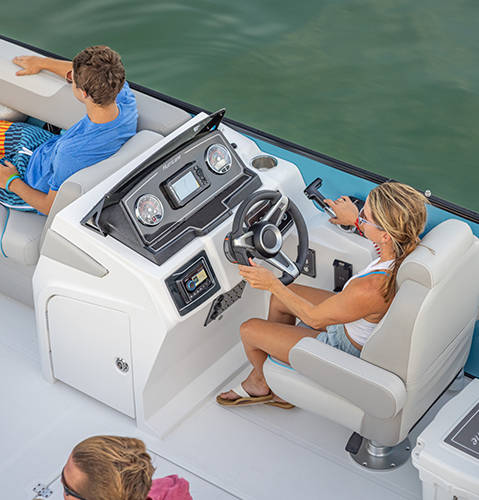 Overhead view of captain's controls and seating on a Hurricane FunDeck boat.
