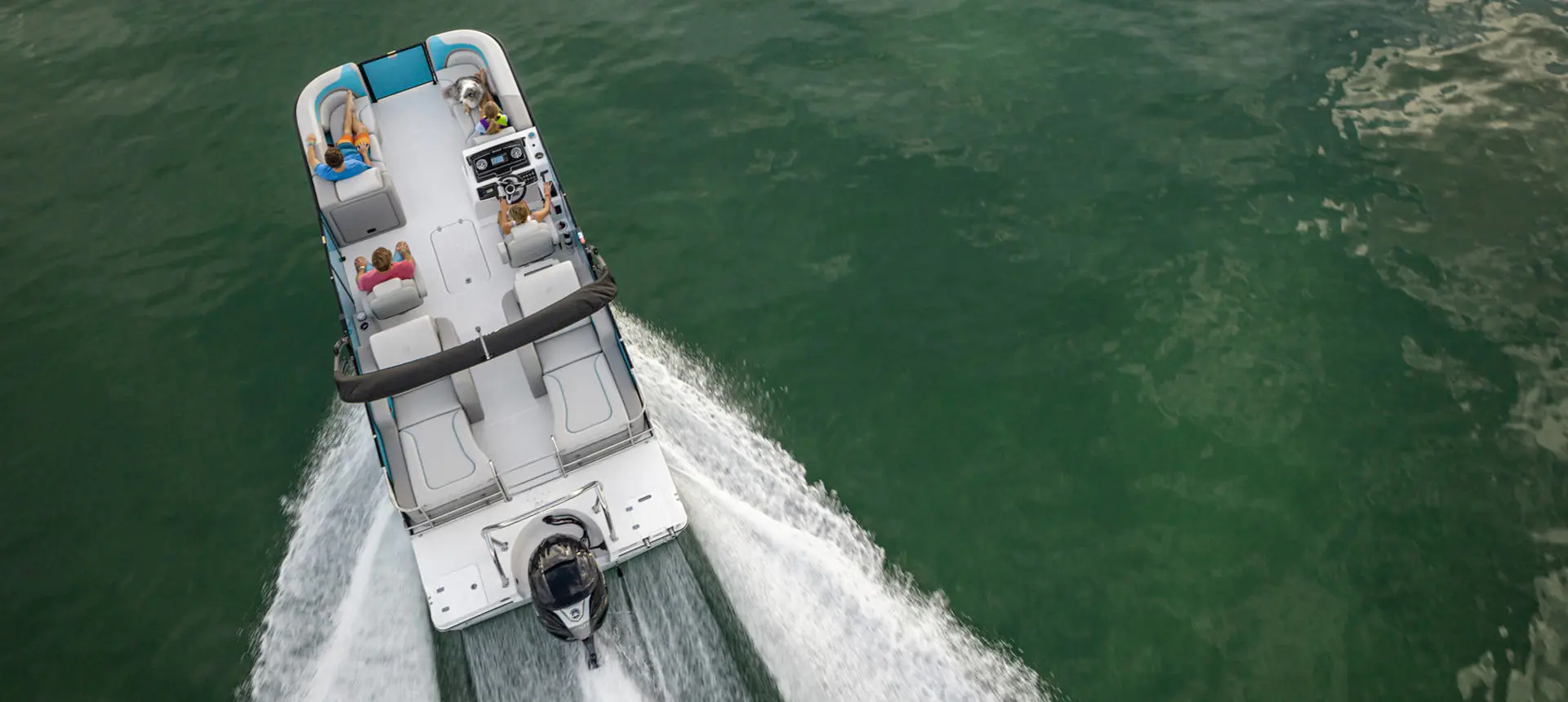 Overhead view of a Hurricane FunDeck boat speeding across the water.