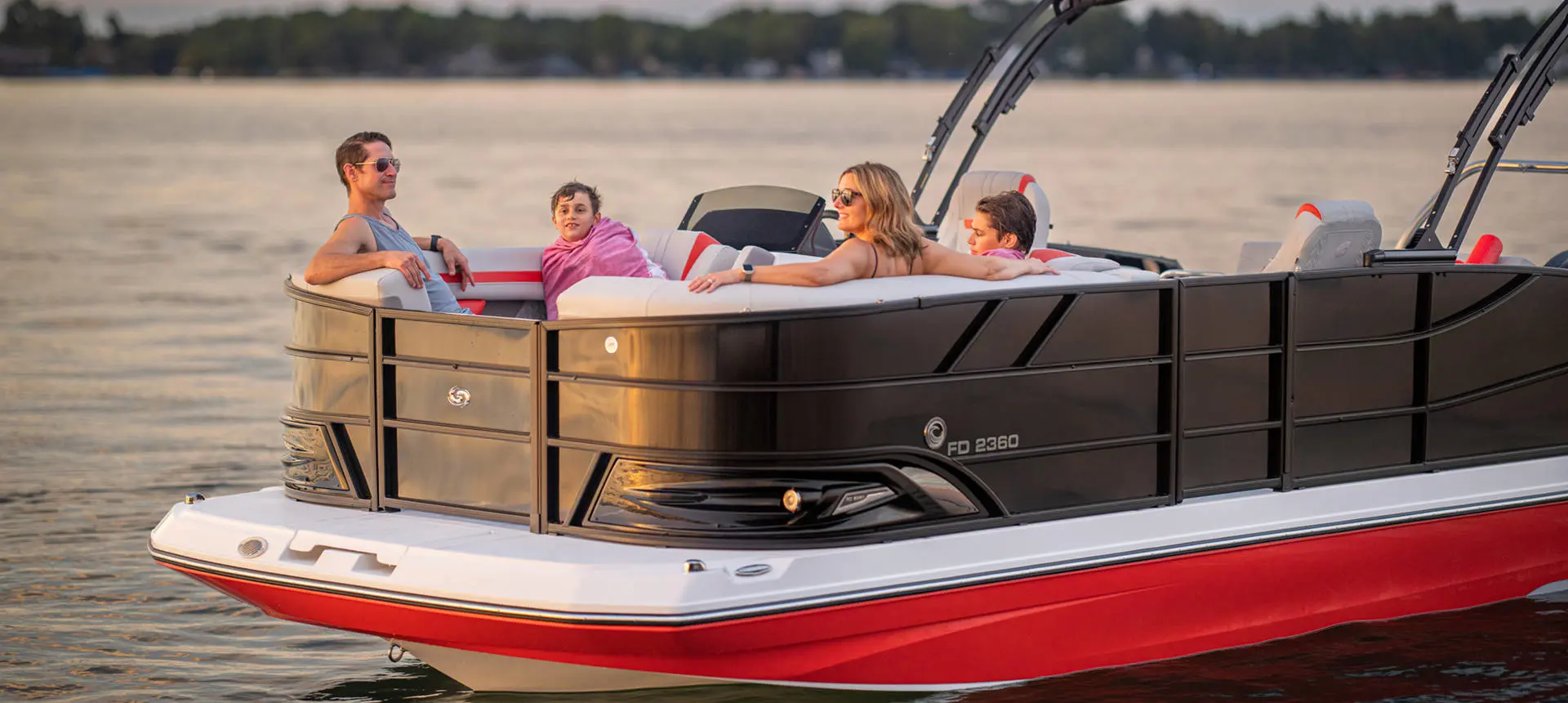 Family lounges in front seating of a Hurricane FunDeck boat.