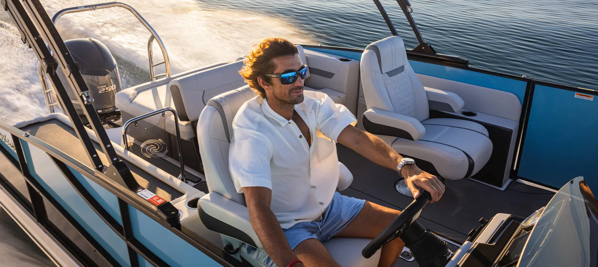 Man captains a Hurricane FunDeck boat.