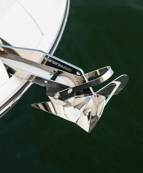 Push-button windlass anchor on a Hurricane SunDeck 2600 Outboard boat. 