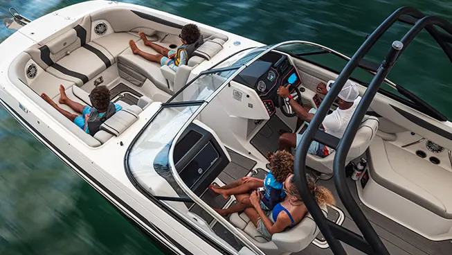 Overhead view of family riding in Hurricane SunDeck 2600 Outboard boat.