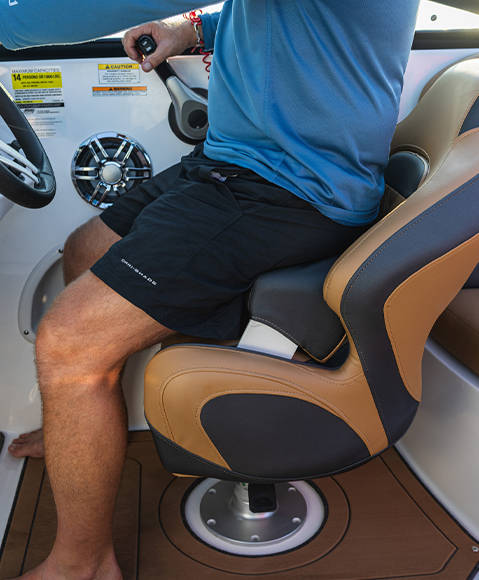 Adjustable bolster on captain's seat on a Hurricane SunDeck 2690 Outboard boat. 