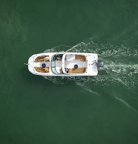 Overhead view of spacious Hurricane SunDeck 2690 Outboard boat cruising on lake. 
