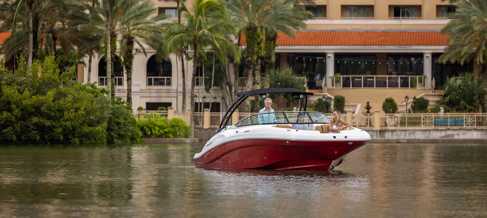 Friends curise through bay on a Hurricane SunDeck 2690 Outboard boat.
