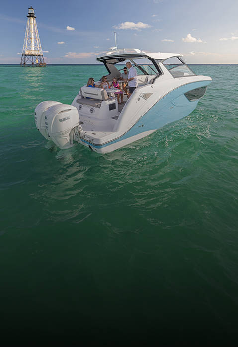 Family enjoying snacks on a parked Hurricane 3200 Outboard boat.