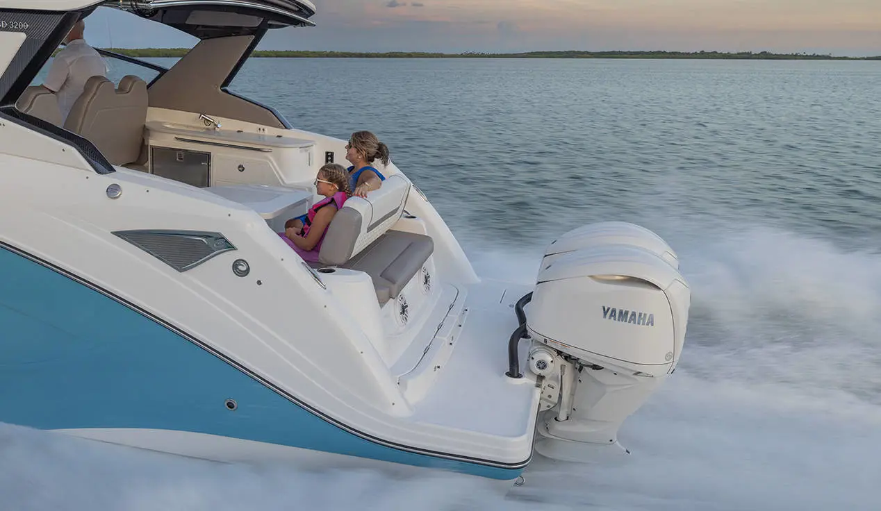 Mother and daugher in rear seating of a Hurricane 3200 Outboard boat.