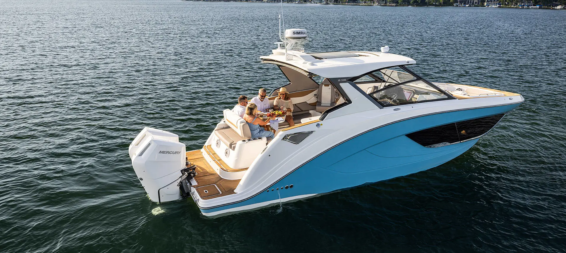 Friends enjoying snacks from rear seating on a Hurricane 3200 Outboard boat.