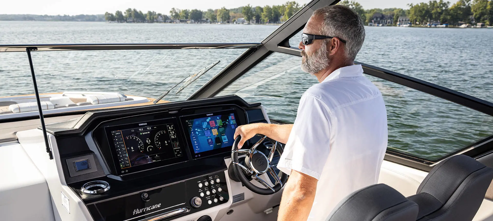 Man captains a Hurricane 3200 Outboard boat.