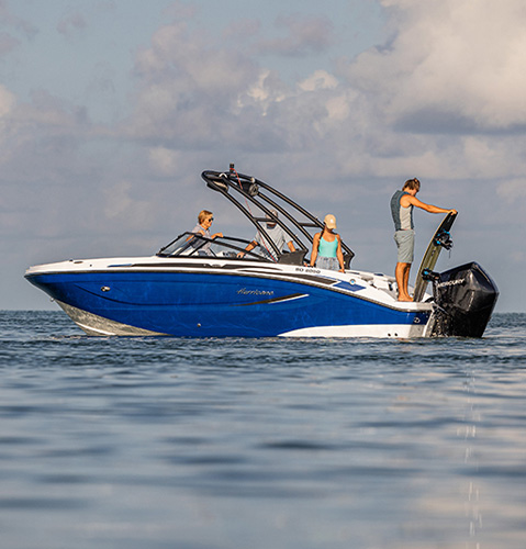 Parked Hurricane Sundeck boat on the water. 