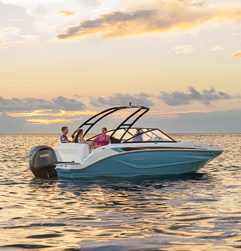 Parked Hurricane Sundeck boat on the water. 