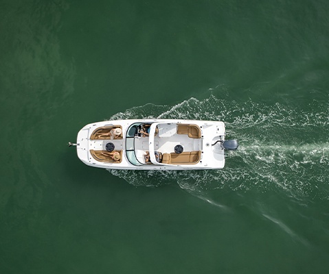 Overhead view of Hurricane entertainment boat cruising across the water. 