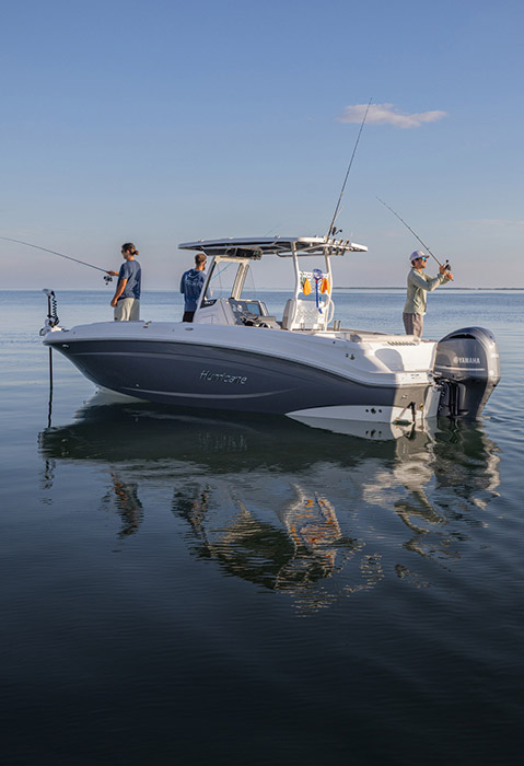 3 men fishing off of a Hurricane fishing boat. 