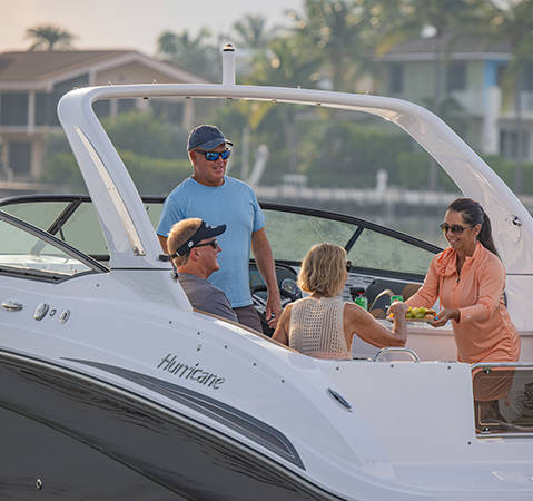 Friends having drinks and snacks on a Hurricane Yacht Certified boat. 