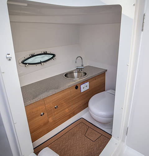 Private enclosed head with sink on a Hurricane Yacht Certified boat. 