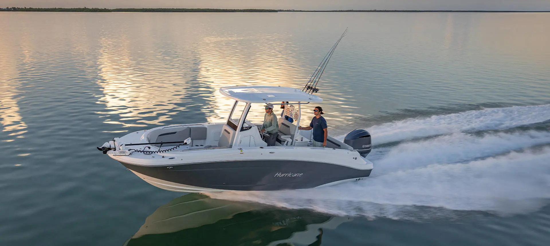 3 men cruising the ocean on a Hurricane fishing boat.