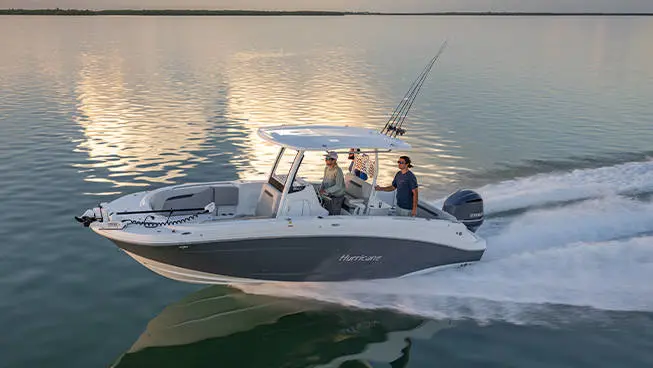 3 men cruising the ocean on a Hurricane fishing boat.