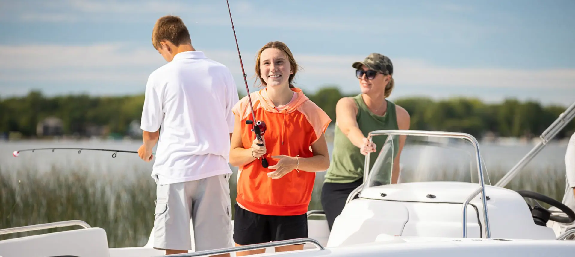 A family enjoying a fishing trip on their Hurricane boat