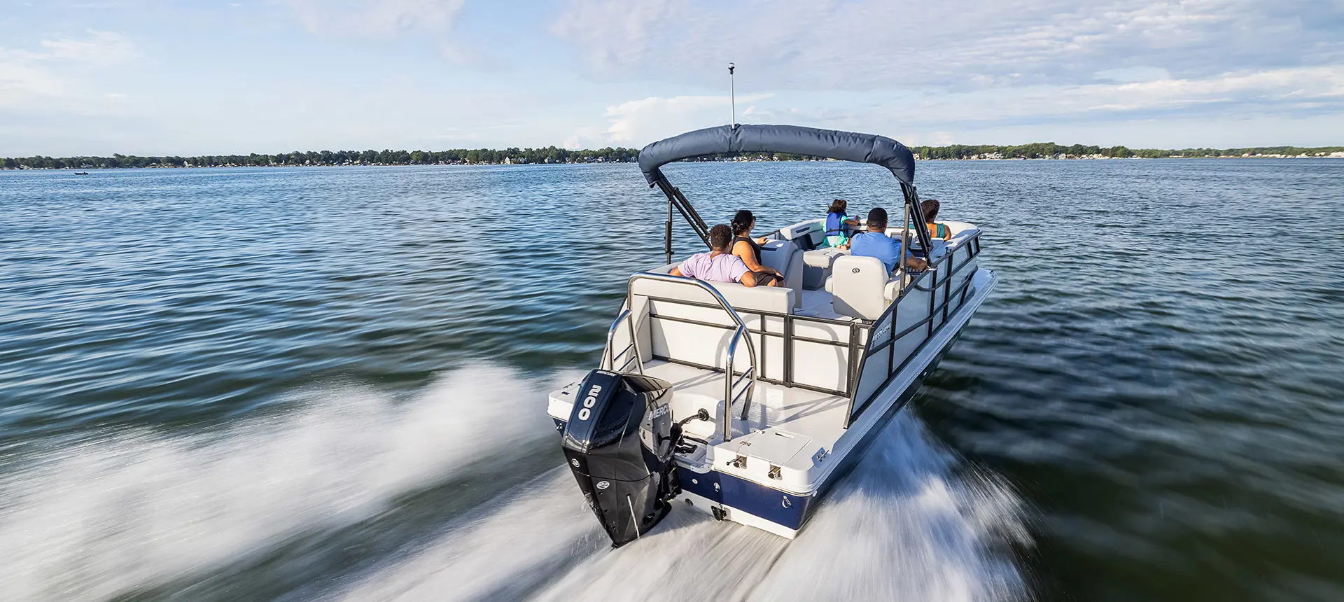Back view of a Hurricane boat in the water
