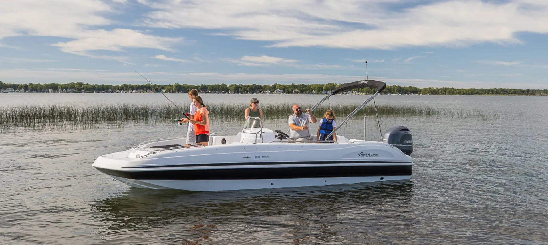 A group of four fishing on their Hurricane boat