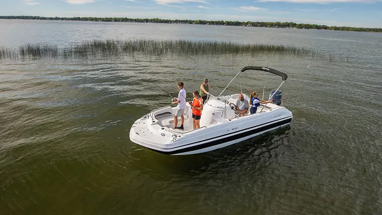family fishing off all ends of a hurricane boat
