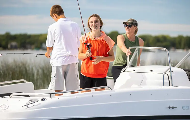 A family enjoying a fishing trip on their Hurricane boat