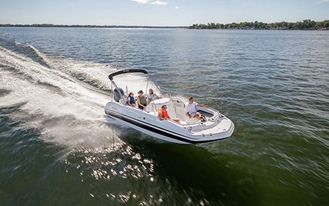 A family riding safely on their Hurricane deck boat