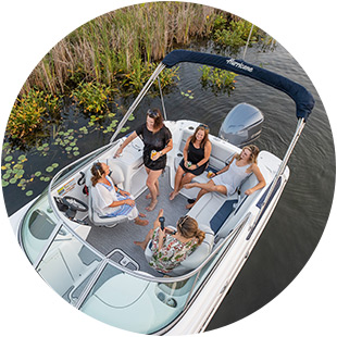 A group of friends relaxing on their Hurricane boat